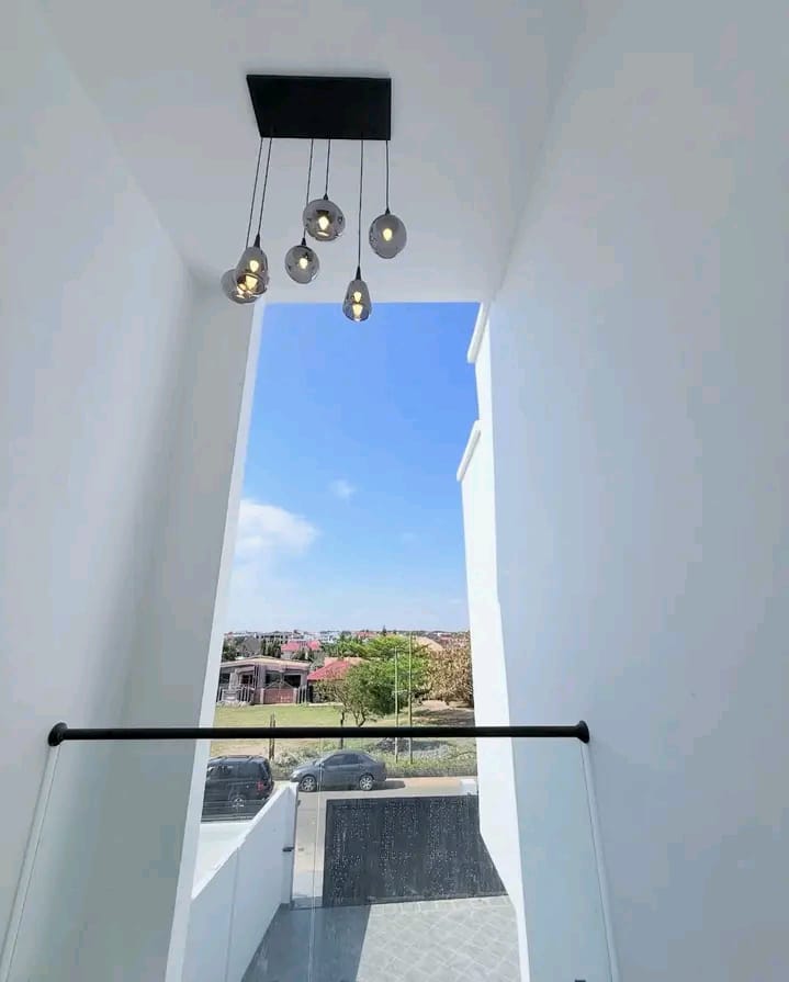 Double-Height Stairwell with Pendant Lighting